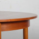 Round, extendable wooden dining table, 1960 - 